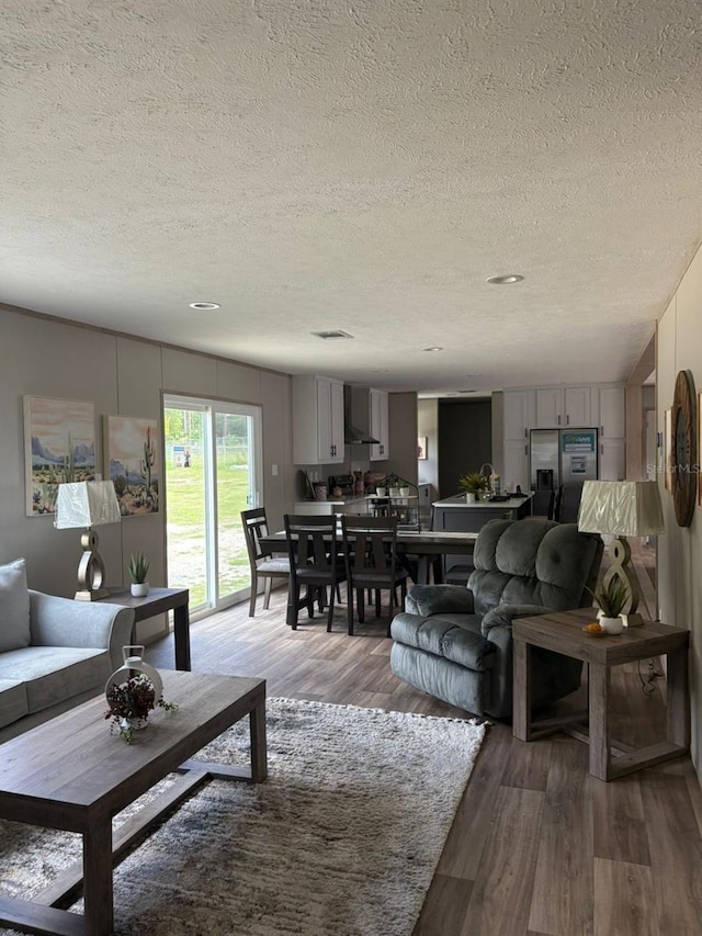 1349NW 109th Ave, Ocala, FL 34482 - living area featuring a textured ceiling and wood finished floors