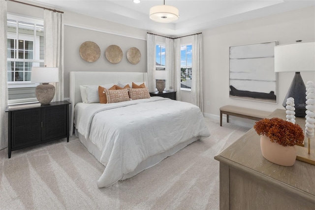 2486 Celebration Blvd, Celebration, FL 34747 - carpeted bedroom with a raised ceiling and baseboards