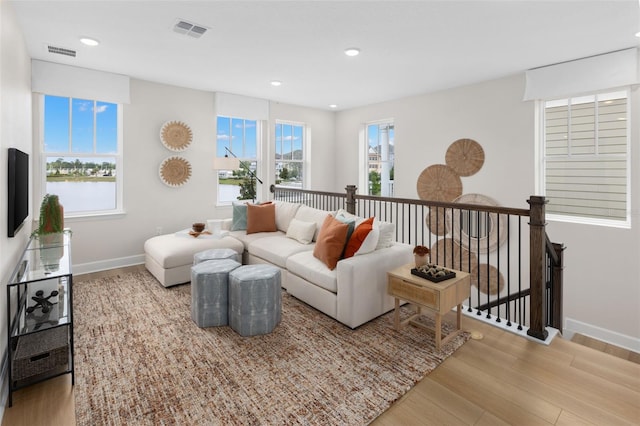 2486 Celebration Blvd, Celebration, FL 34747 - living room featuring wood finished floors and recessed lighting