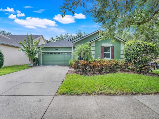 5263 Beach River Rd, Windermere, FL 34786 - view of front of house featuring stucco siding, a garage, driveway, and a front yard