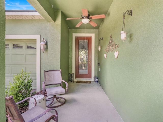 5263 Beach River Rd, Windermere, FL 34786 - view of exterior entry with stucco siding and a ceiling fan