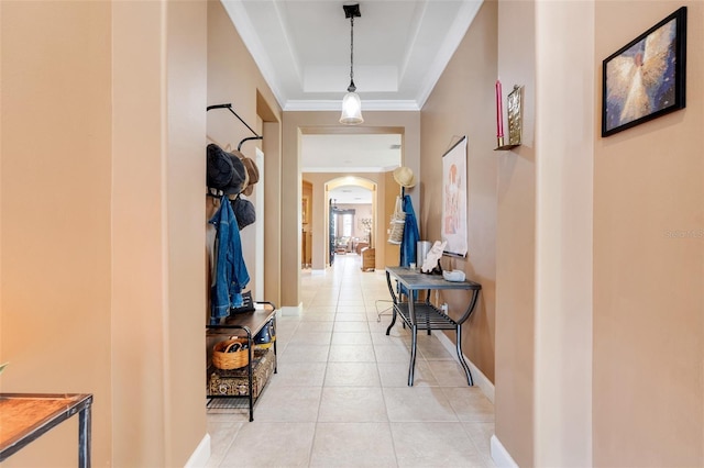 5263 Beach River Rd, Windermere, FL 34786 - hallway featuring arched walkways, a raised ceiling, crown molding, and light tile patterned flooring