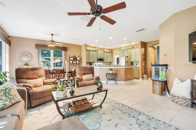5263 Beach River Rd, Windermere, FL 34786 - living area featuring a ceiling fan, arched walkways, light tile patterned floors, and recessed lighting