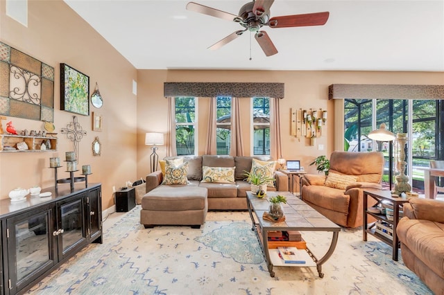 5263 Beach River Rd, Windermere, FL 34786 - living room with a ceiling fan and baseboards