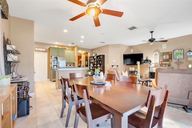 5263 Beach River Rd, Windermere, FL 34786 - dining area featuring a ceiling fan, arched walkways, light tile patterned floors, and recessed lighting