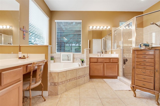 5263 Beach River Rd, Windermere, FL 34786 - bathroom featuring two vanities, a stall shower, a bath, and tile patterned floors