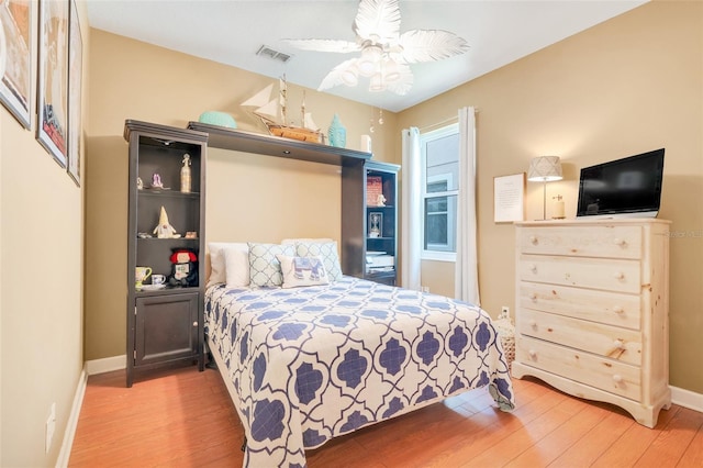 5263 Beach River Rd, Windermere, FL 34786 - bedroom featuring wood finished floors and a ceiling fan