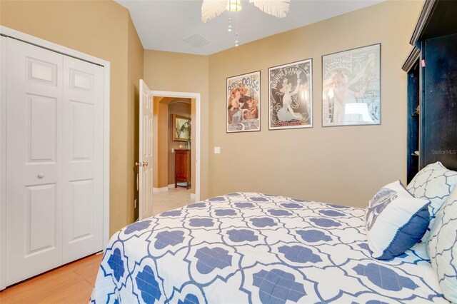 5263 Beach River Rd, Windermere, FL 34786 - bedroom featuring light wood finished floors, a closet, and ceiling fan