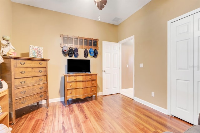 5263 Beach River Rd, Windermere, FL 34786 - bedroom featuring light wood finished floors, a closet, and a ceiling fan