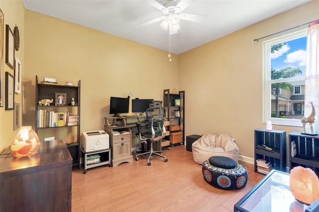 5263 Beach River Rd, Windermere, FL 34786 - home office with ceiling fan and wood finished floors