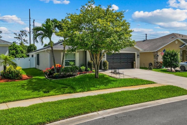 1787 Attilburgh Blvd, Melbourne, FL 32904 - view of front facade with stucco siding, an attached garage, and concrete driveway