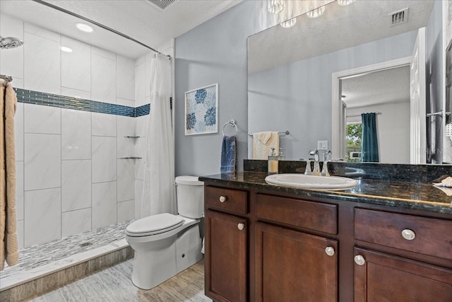 1787 Attilburgh Blvd, Melbourne, FL 32904 - full bathroom with vanity, tiled shower, wood finished floors, and a textured ceiling