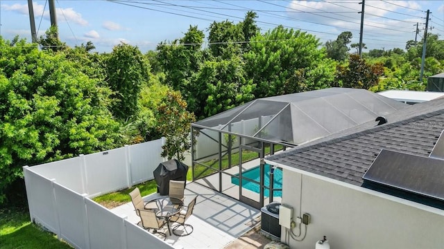 1787 Attilburgh Blvd, Melbourne, FL 32904 - view of pool with a fenced backyard, a grill, a patio, and a lanai