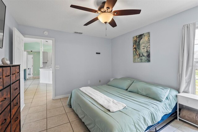 705 Ibis Ave, Deltona, FL 32738 - bedroom featuring light tile patterned flooring and ceiling fan