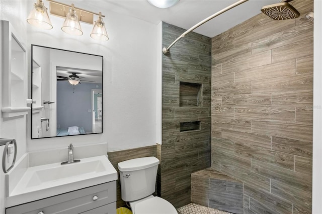 705 Ibis Ave, Deltona, FL 32738 - bathroom with ceiling fan, a tile shower, vanity, and tile walls