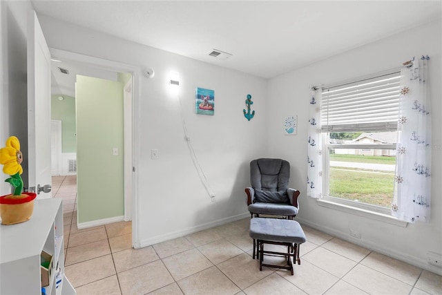 705 Ibis Ave, Deltona, FL 32738 - sitting room featuring light tile patterned floors and baseboards