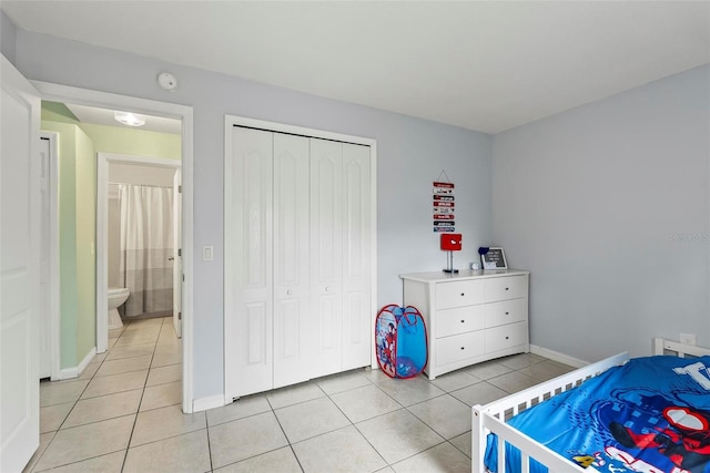 705 Ibis Ave, Deltona, FL 32738 - bedroom featuring light tile patterned floors and a closet