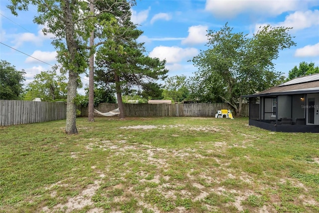 705 Ibis Ave, Deltona, FL 32738 - fenced backyard with a sunroom
