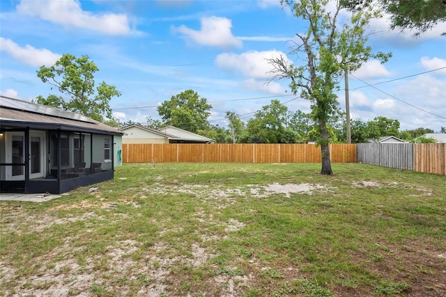 705 Ibis Ave, Deltona, FL 32738 - fenced backyard with a sunroom