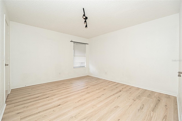 5160 Conroy Rd Unit 21, Orlando, FL 32811 - unfurnished room featuring light wood finished floors and a textured ceiling
