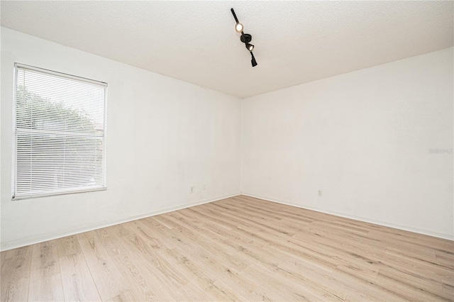 5160 Conroy Rd Unit 21, Orlando, FL 32811 - unfurnished room featuring wood finished floors and a textured ceiling