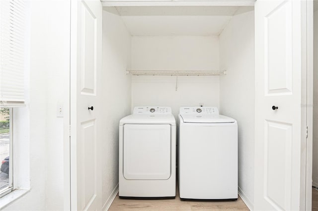 5160 Conroy Rd Unit 21, Orlando, FL 32811 - laundry area featuring separate washer and dryer and light wood-type flooring