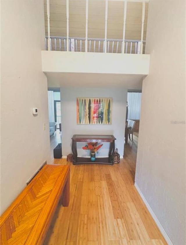116 Palm View Ct Unit 3535/6, Haines City, FL 33844 - corridor featuring a high ceiling and wood finished floors