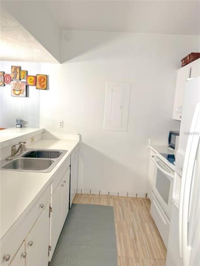 116 Palm View Ct Unit 3535/6, Haines City, FL 33844 - kitchen with white appliances, white cabinets, electric panel, light wood-style floors, and light countertops