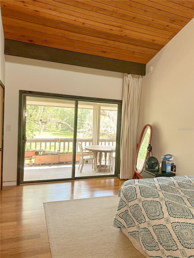 116 Palm View Ct Unit 3535/6, Haines City, FL 33844 - bedroom featuring access to exterior, wooden ceiling, wood finished floors, and lofted ceiling