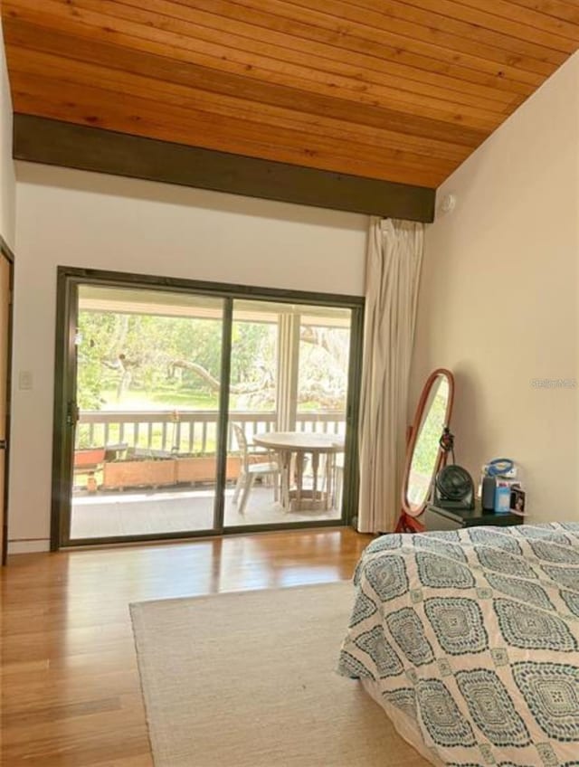 116 Palm View Ct Unit 3535/6, Haines City, FL 33844 - bedroom with multiple windows, wood ceiling, access to exterior, wood finished floors, and lofted ceiling