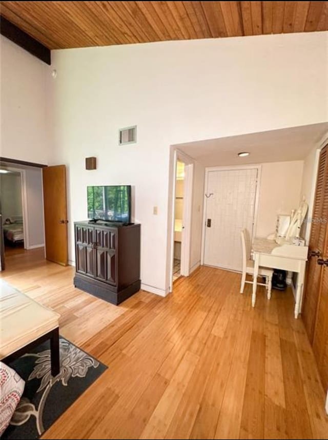 116 Palm View Ct Unit 3535/6, Haines City, FL 33844 - living area with high vaulted ceiling, light wood finished floors, and a wood ceiling with exposed beams