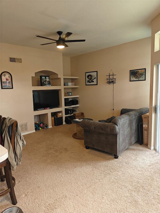 7230 Westpointe Blvd Unit 1235, Orlando, FL 32835 - carpeted living area featuring a ceiling fan and baseboards