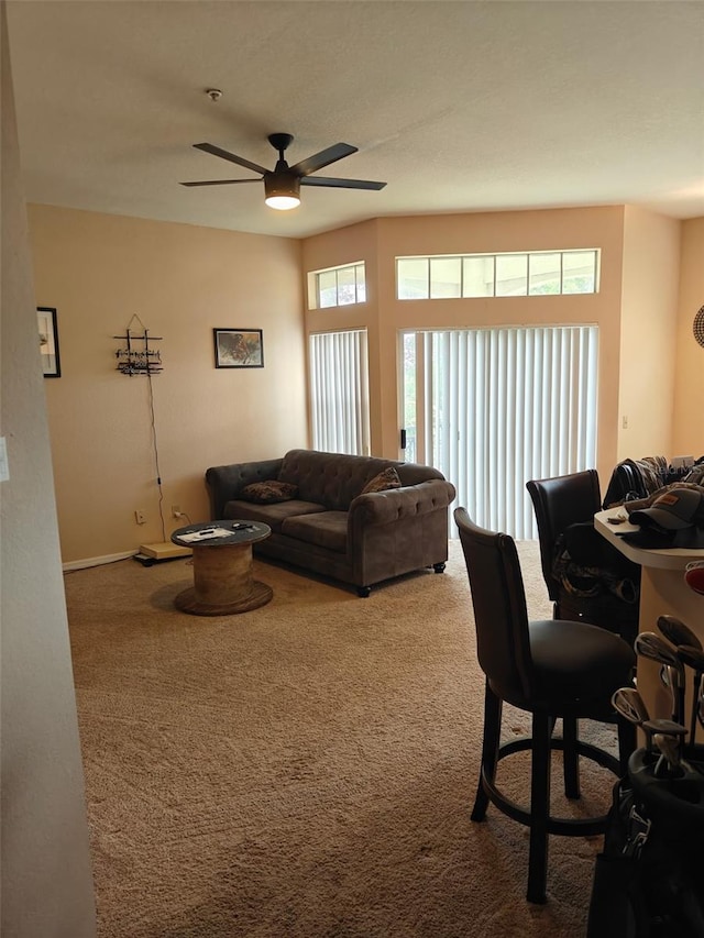7230 Westpointe Blvd Unit 1235, Orlando, FL 32835 - living area with carpet flooring and a ceiling fan