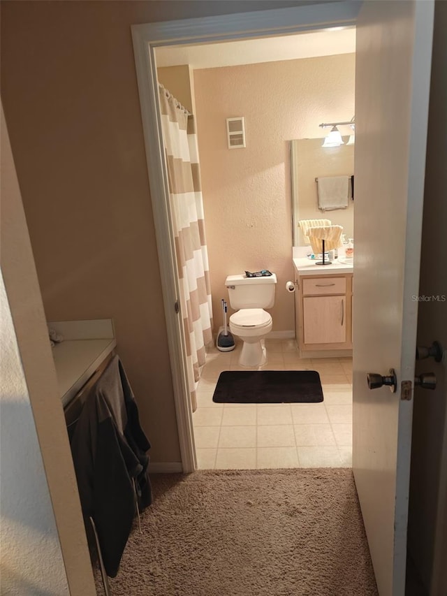 7230 Westpointe Blvd Unit 1235, Orlando, FL 32835 - full bathroom featuring vanity, tile patterned flooring, and curtained shower