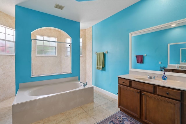 1542 Wescott Loop, Winter Springs, FL 32708 - bathroom featuring a bath, tile patterned floors, and vanity