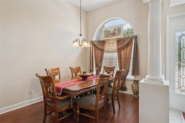 1542 Wescott Loop, Winter Springs, FL 32708 - dining room featuring decorative columns, a chandelier, and wood finished floors