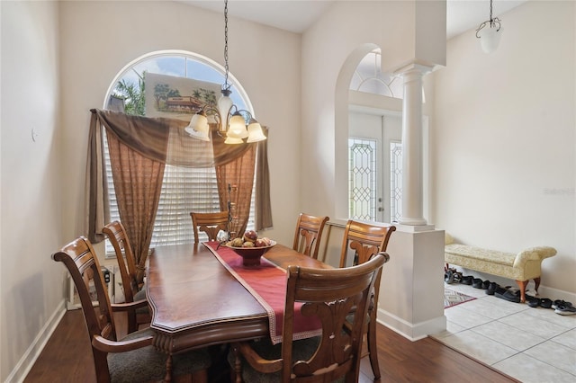 1542 Wescott Loop, Winter Springs, FL 32708 - dining area featuring decorative columns, plenty of natural light, and wood finished floors