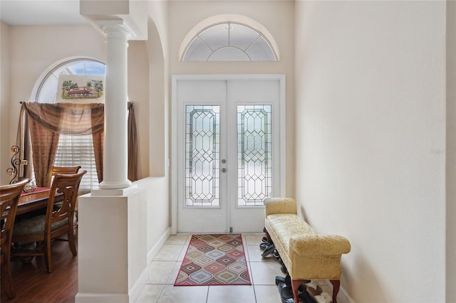 1542 Wescott Loop, Winter Springs, FL 32708 - foyer entrance with french doors, ornate columns, arched walkways, and light tile patterned flooring