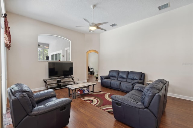 1542 Wescott Loop, Winter Springs, FL 32708 - living area featuring a ceiling fan, wood finished floors, a textured ceiling, and arched walkways