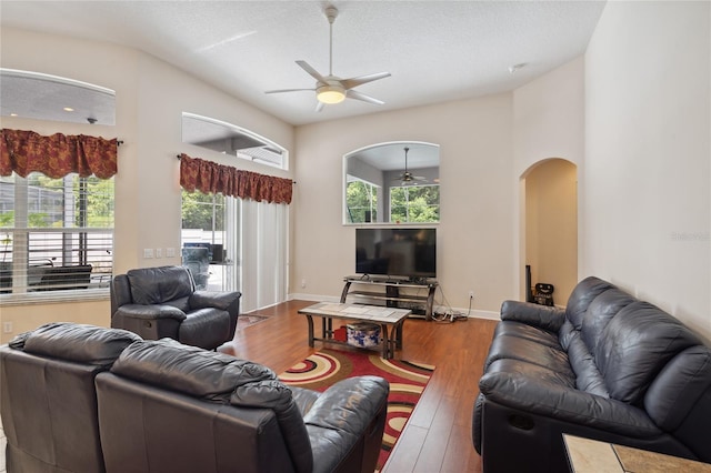 1542 Wescott Loop, Winter Springs, FL 32708 - living room with a ceiling fan, arched walkways, and wood finished floors