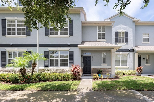 2211 J Lawson Blvd, Orlando, FL 32824 - townhome / multi-family property with stucco siding and stone siding