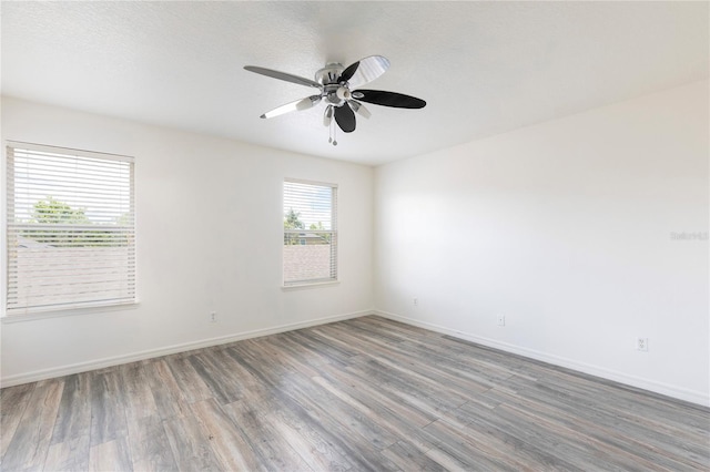 2211 J Lawson Blvd, Orlando, FL 32824 - empty room featuring wood finished floors and a ceiling fan