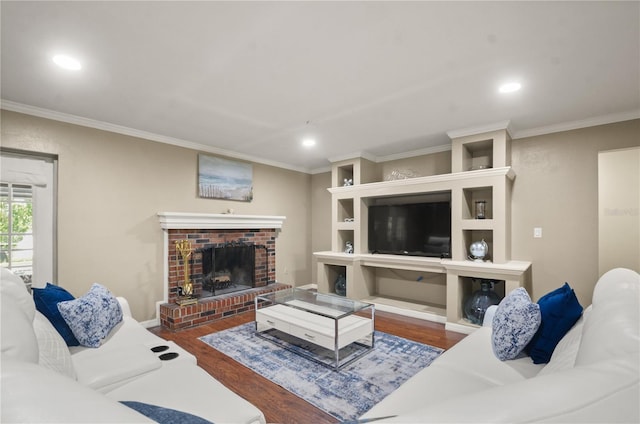 209 7th St S, Haines City, FL 33844 - living room with wood finished floors, crown molding, recessed lighting, and a fireplace