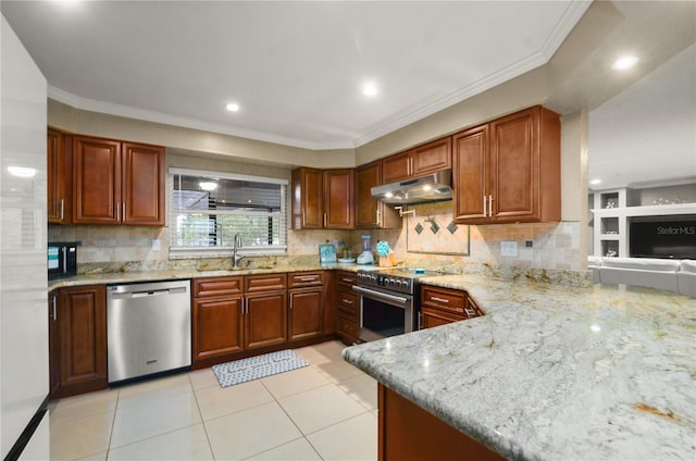 209 7th St S, Haines City, FL 33844 - kitchen featuring appliances with stainless steel finishes, under cabinet range hood, light stone countertops, crown molding, and backsplash