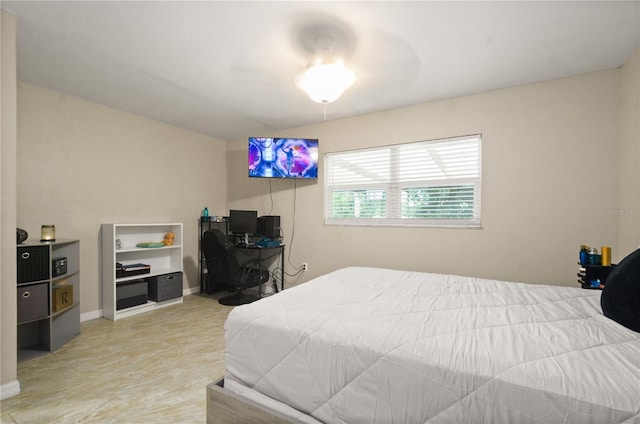 209 7th St S, Haines City, FL 33844 - bedroom featuring baseboards and a ceiling fan