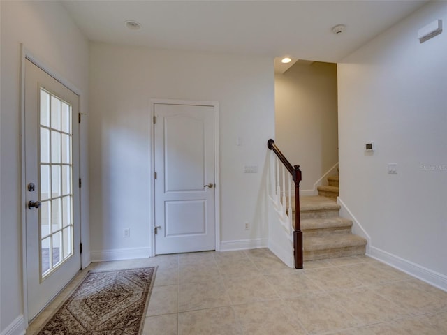 17322 Chateau Pine Way, Clermont, FL 34711 - foyer entrance featuring light tile patterned floors, stairway, and recessed lighting