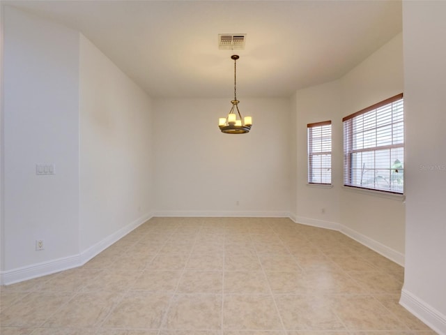 17322 Chateau Pine Way, Clermont, FL 34711 - unfurnished room with a chandelier and baseboards