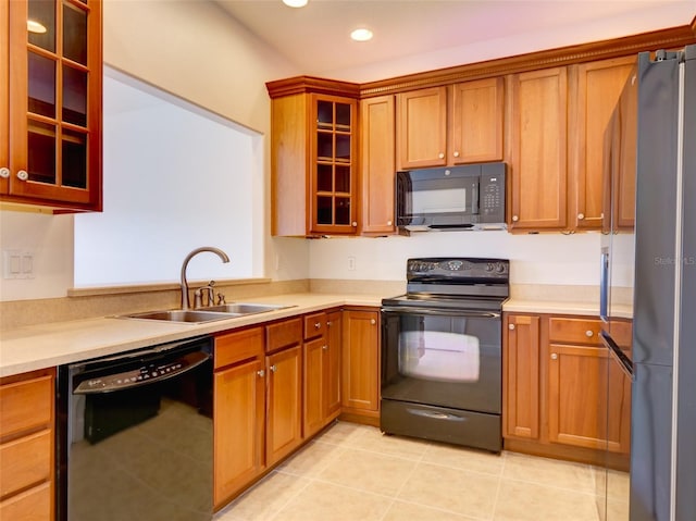 17322 Chateau Pine Way, Clermont, FL 34711 - kitchen featuring black appliances, recessed lighting, light countertops, glass insert cabinets, and brown cabinetry