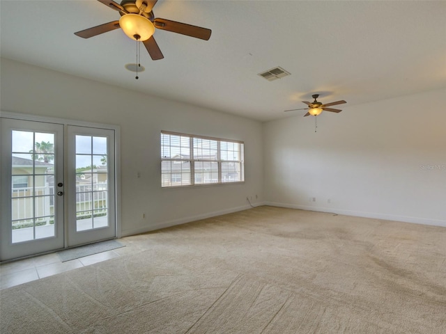 17322 Chateau Pine Way, Clermont, FL 34711 - empty room with french doors, ceiling fan, and light colored carpet