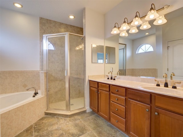 17322 Chateau Pine Way, Clermont, FL 34711 - bathroom with double vanity, a bath, and a stall shower
